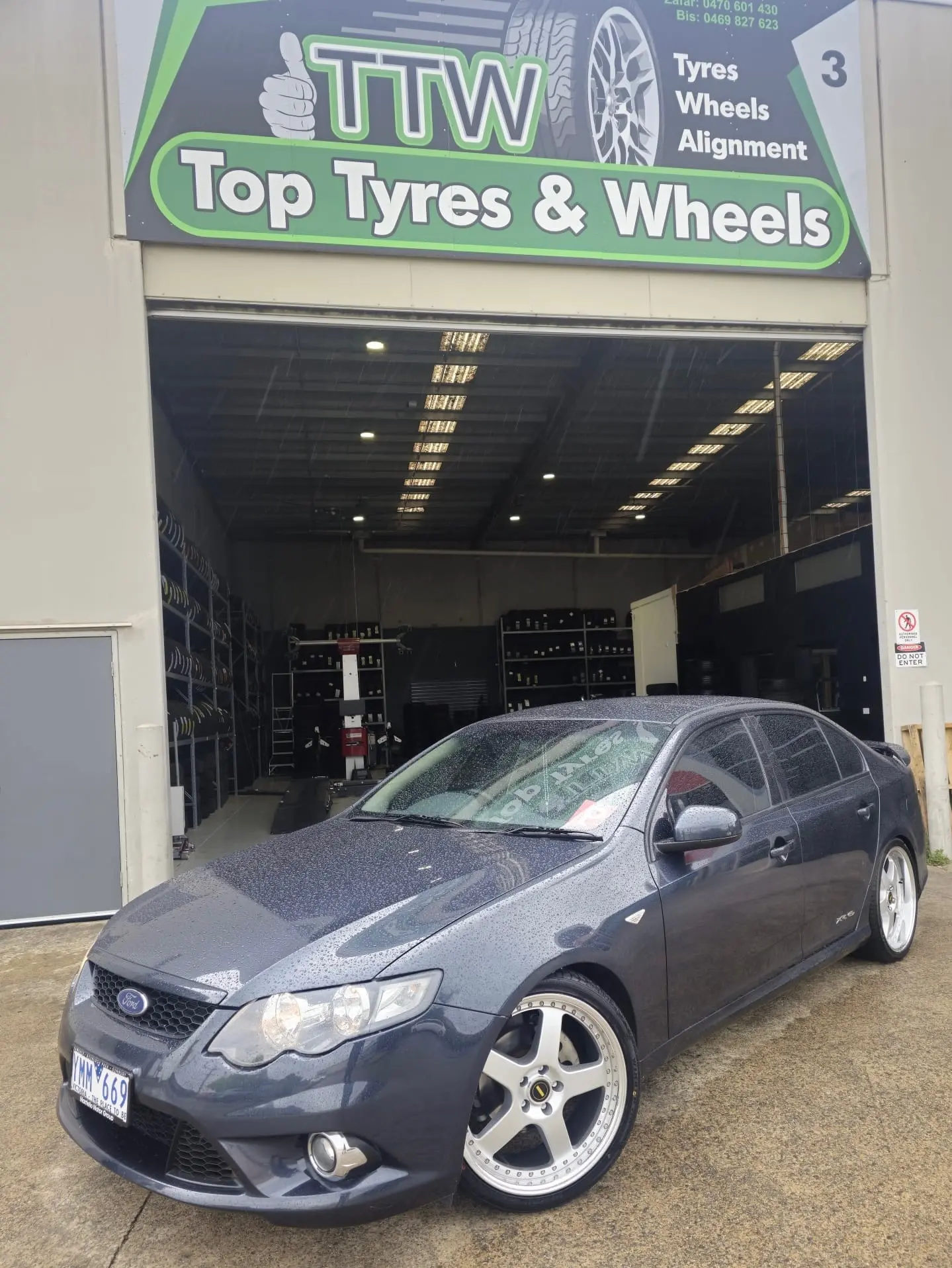 Grey Ford sedan with fitted silver alloy wheels